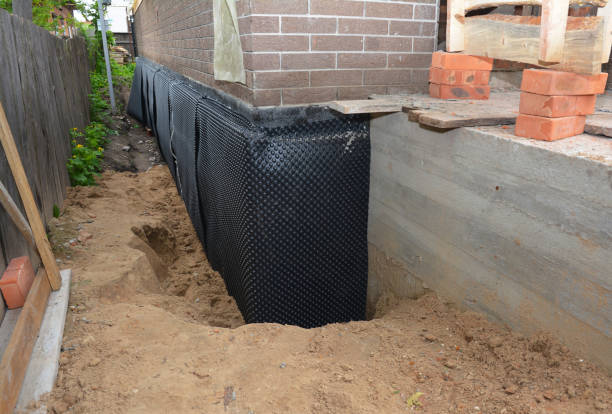 SJ Waterproofing Pros technician performing targeted Interior Drainage System assessment in Pullman, MI
